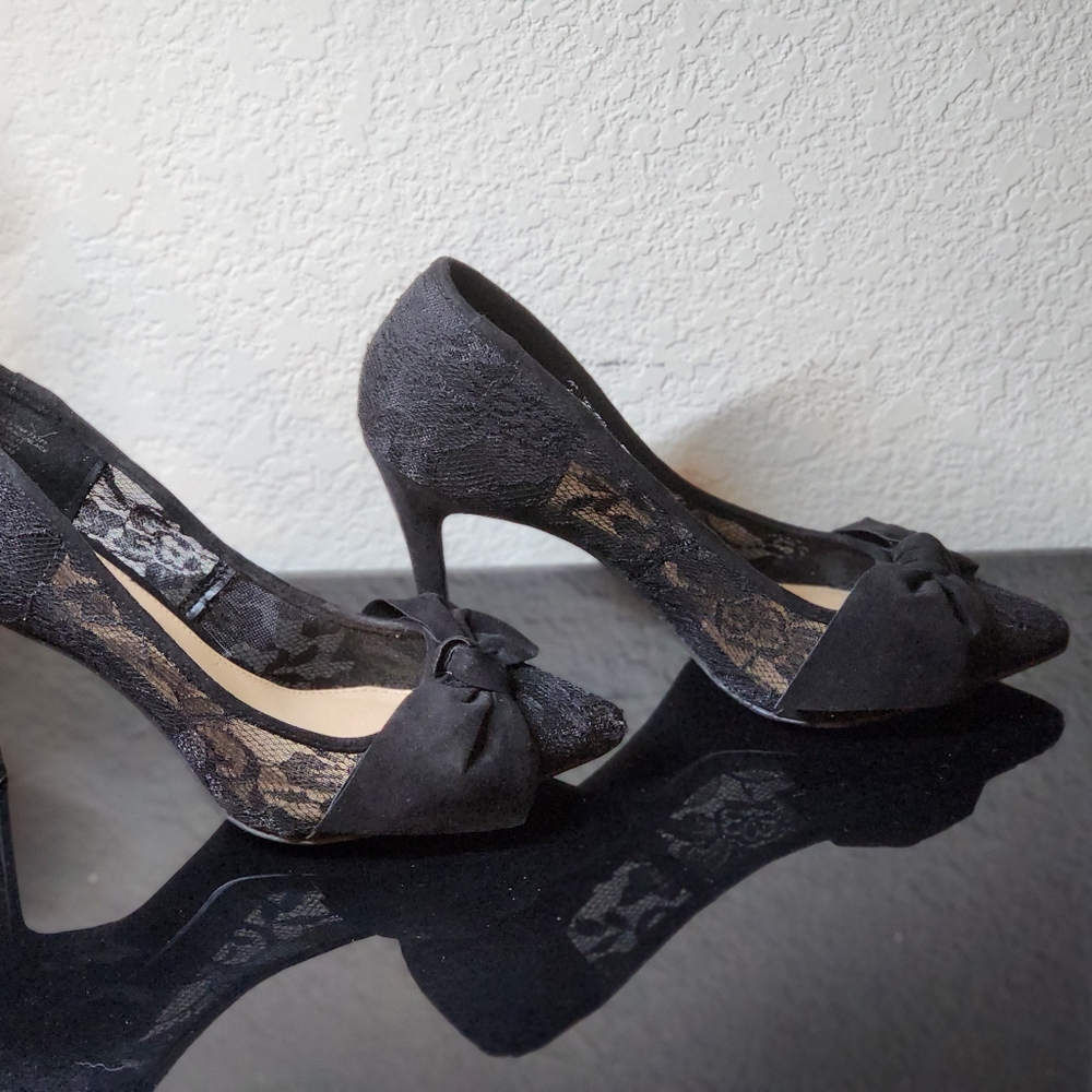 New with box worn once. Black lace high heels with bow on toes size 10